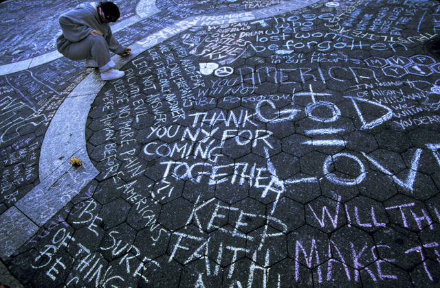 USA. New York City. September 15, 2001. Signing a memorial in Union Square. MAGNUM/Susan Meiselas