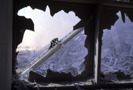 USA. New York City. 2001. Firefighter seen through blown out windows of the World Financial Center. MAGNUM/Steve Mc Curry