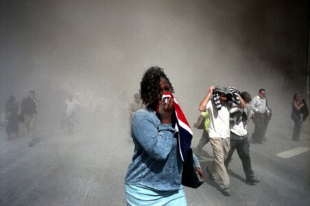 USA. NYC. 9/11/2001. People use masks made out of clothing to protect themselves from dust that is thick in the air after the collpase of the World Trade Center towers. MAGNUM/Gilles Peress